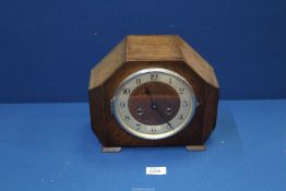 An oak two train Art Deco style Mantle Clock having Arabic numerals with pendulum and key,