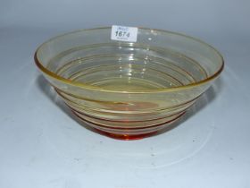 A 1930's Whitefriars conical shaped amber glass bowl by Barnaby Powell having spiralled trails and