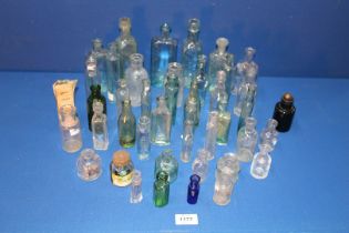 A quantity of old small glass bottles including; ink, medicinal, essence, Old-Sol, Paterson, etc.