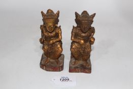 A fine pair of carved and gilded small guardian figures, Cambodia (or Indonesia), 18th -19th c.