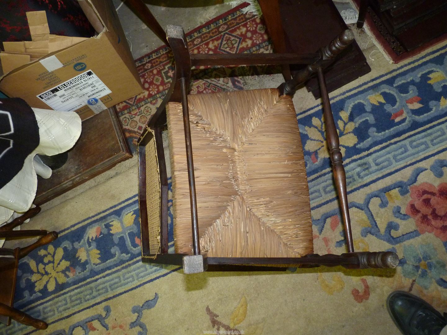A Mahogany framed low open armed Elbow Chair standing on turned front legs and having a woven - Image 3 of 6