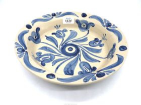 A Horace Elliot Arts & Crafts pottery bowl having blue and white design, 11" diameter (large crack).