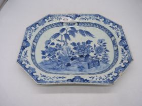 An octagonal blue and white meat plate, with willow and peonies/chrysanthemums by a fence,