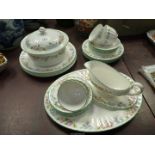 A Royal Worcester four place setting part Dinner/Tea service in "English Garden" pattern.