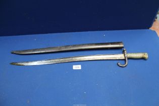 A brass handled Bayonet in sheath, number on hilt and sheath '21082,' inscribed and dated 1871,