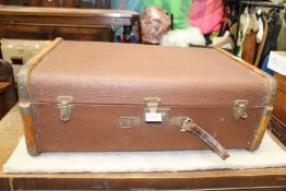 An early 1900's Steamer trunk, banded in wood,