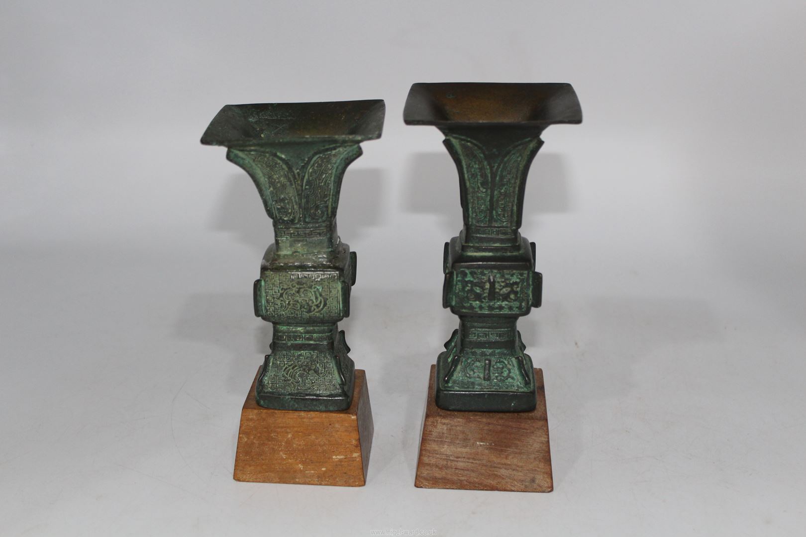 A pair of small Chinese bronze 'Gu' vases, probably Ming dynasty, on custom made wooden stands, - Image 2 of 18