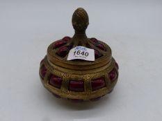 A ruby glass brass caged Trinket box.