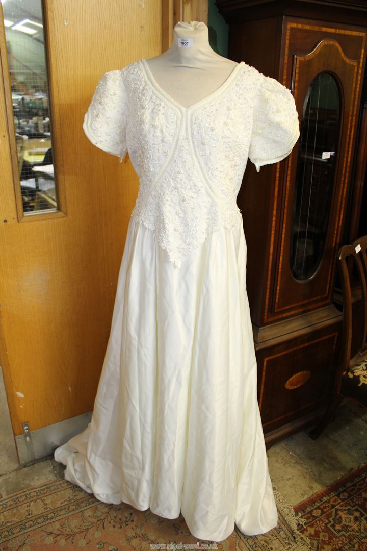 A Stephanie Darling Ivory Wedding dress with embellished and beaded bodice with short sleeves,