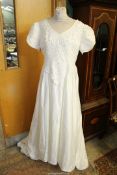 A Stephanie Darling Ivory Wedding dress with embellished and beaded bodice with short sleeves,