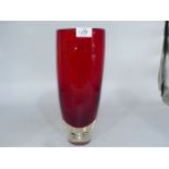 A very heavy red tapered Art Glass vase with deep clear concave base containing four floating