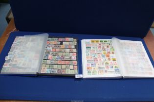 Two 32 page stock books containing over 3000 World stamps.