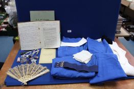 Two 1940's/1950's Midwife uniforms with a student midwife's birth note book from Dundee Royal