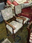 A pair of Oak framed open armed Elbow Chairs having turned front legs and "H" stretchers,