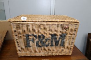 A large Fortnum and Masons hamper with lid, 22" long, 14" high.