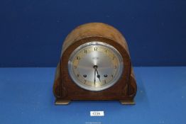 A Garrard mantle Clock with key and pendulum, 9 1/2" wide x 8 3/4" high.