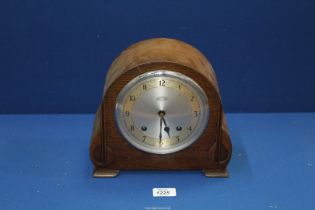 A Garrard mantle Clock with key and pendulum, 9 1/2" wide x 8 3/4" high.