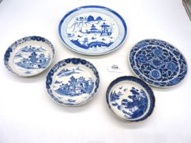 Five pieces of blue and white china; village river scene plate,