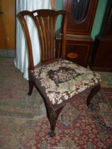 A broad seated Mahogany framed Georgian side Chair having a fretworked backrest and elegant canted