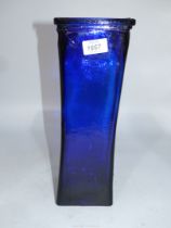 A very heavy cobalt blue square glass vase with slightly curved form, 14" tall, 5" square.