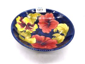 A Moorcroft 'Hibiscus' bowl in dark blue, 7" diameter.