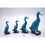 A set of four oriental, graduated sitting Ducks in turquoise glaze, from 4 1/2'' tall to 8'' tall.