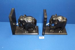 A pair of Elephant ebony Bookends, 8'' wide x 7'' high.