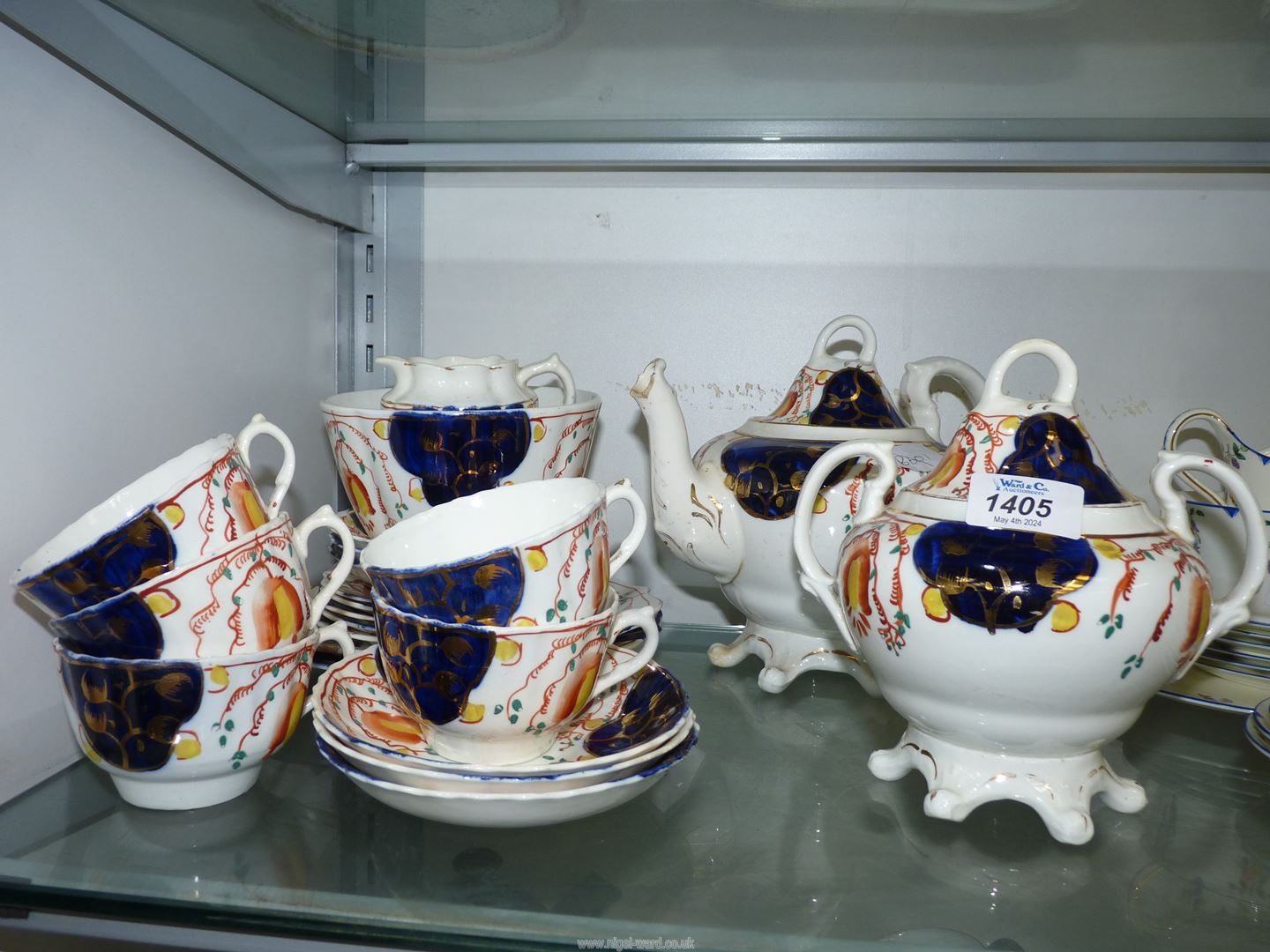 A Gaudy Welsh part Teaset comprising teapot, lidded sucrier, sugar bowl, cream jugs, five cups,