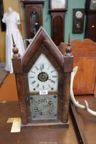 An eight day Mantle clock with Roman numerals and central dial in brass (with Roman numerals),