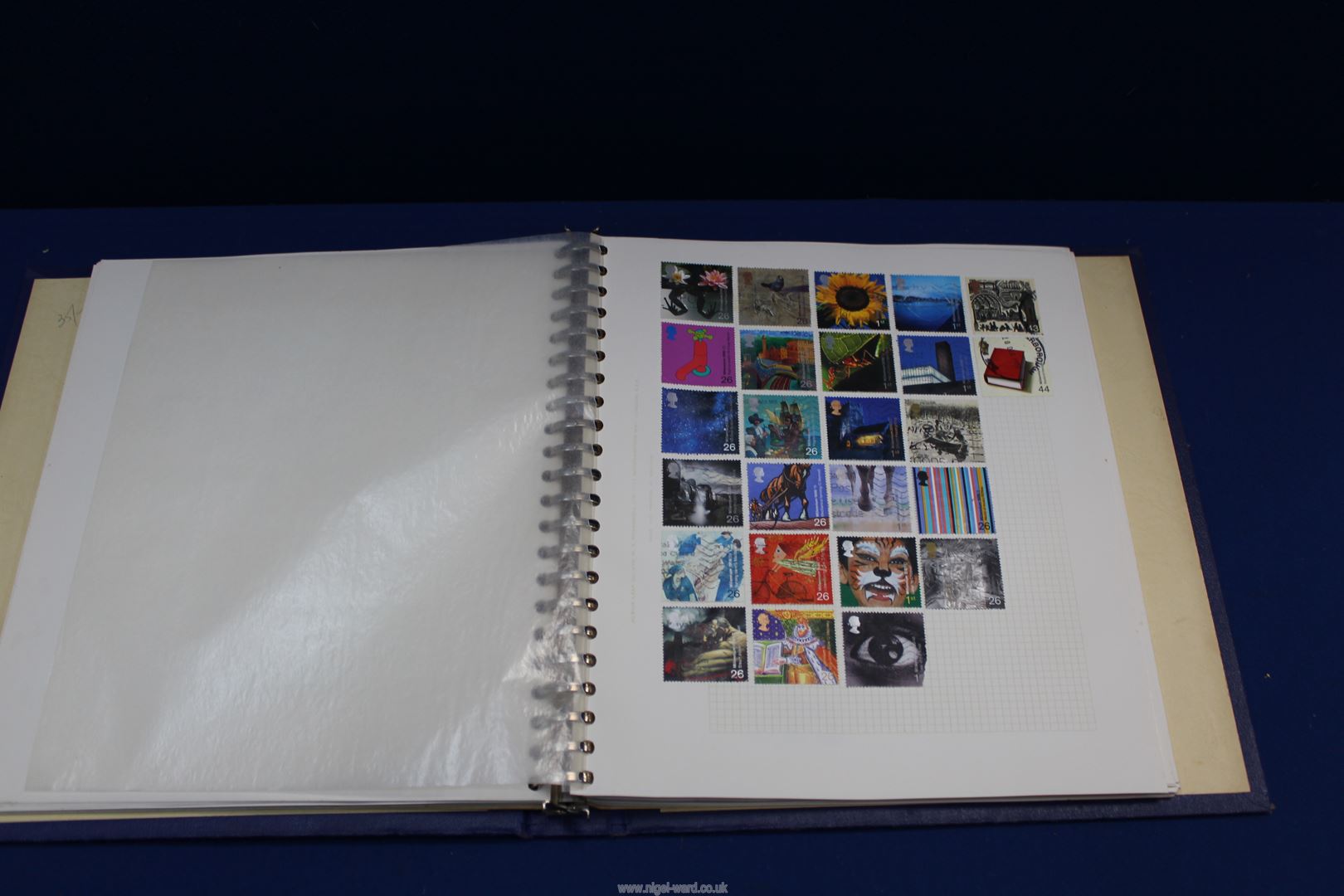 A blue lever Album with interleaves containing approximately 900 different British and World stamps. - Image 2 of 4