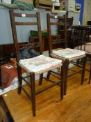 A pair of Oak framed Bedroom Chairs having fretworked cross-splats,