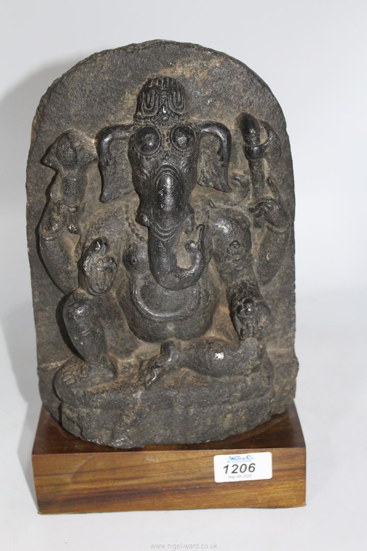 A rare and very early Indian black stone stele, carved with a figure of Ganesh,