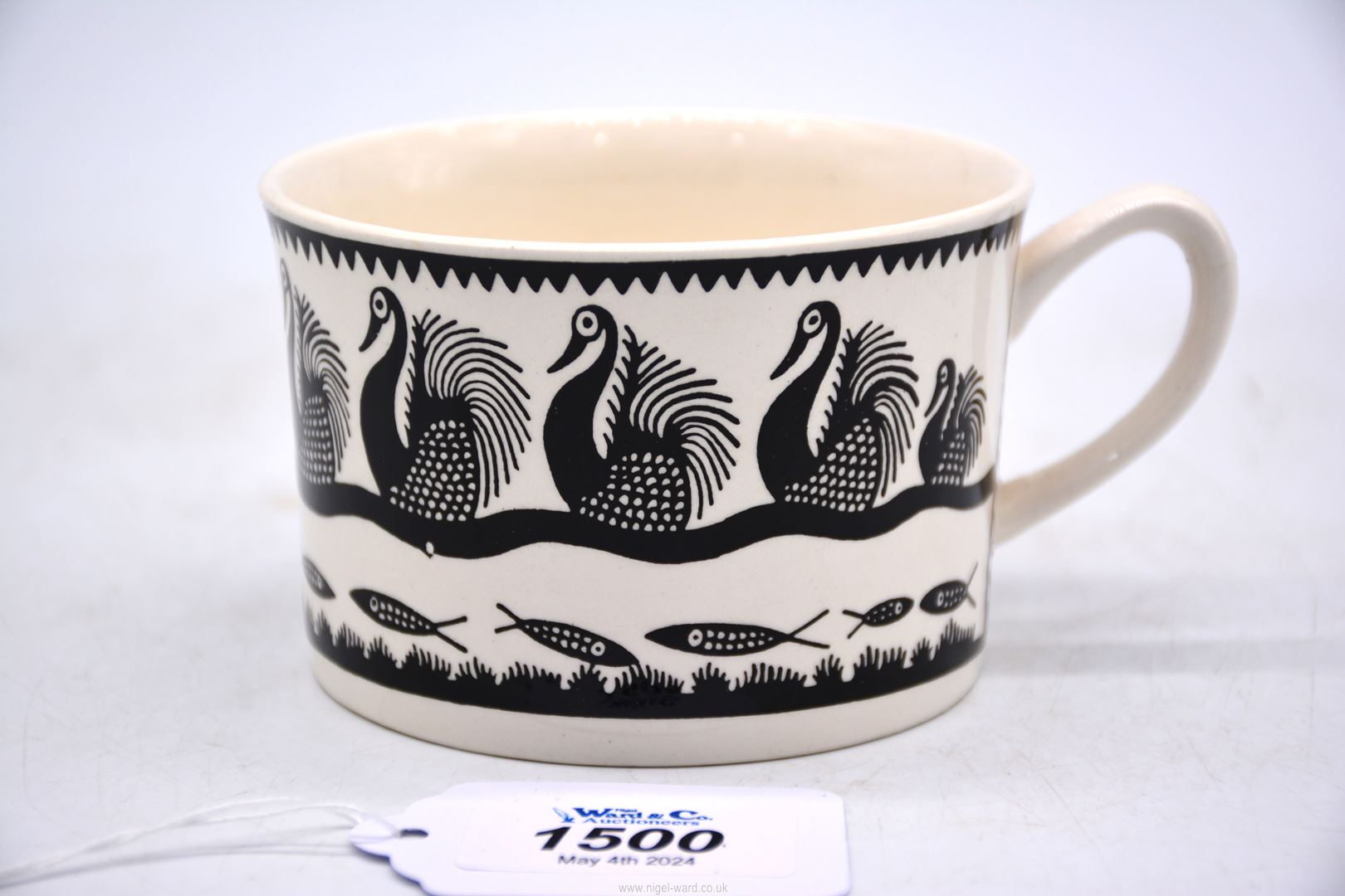 A vintage Scottie Wilson for Royal Worcester mug in swan design.