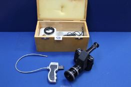 A Robot Star 35mm camera with telescope attachment plus accessories in a wooden case.