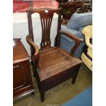 A peg-joyned Oak framed Georgian Commode Chair (unfurnished).