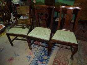Three classic Georgian design Mahogany side/dining chairs (two with damage) with drop in seats.