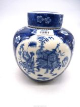 A Chinese Ginger jar, with lid, with Prunus decoration and 'windows' of vases and furniture etc.