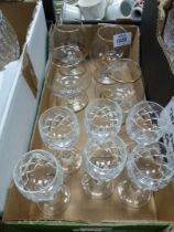 Six Crystal aperitif glasses and four navy Brandy glasses, gold rimmed.