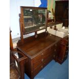 A Mahogany dressing Chest of two long and two short Drawers,