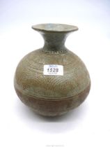 A bulbous vase, grey/blue (stone colour) - brown with geometric incised decoration, 8 1/4" tall.