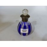A blue and clear glass perfume bottle having Sterling silver collar and rim,