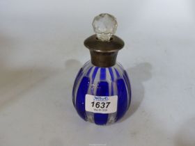 A blue and clear glass perfume bottle having Sterling silver collar and rim,