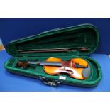 An Antoni Debut Violin in soft case, 21" long, with box, some strings missing.