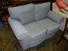 A modern flecked grey upholstered two seater Settee,