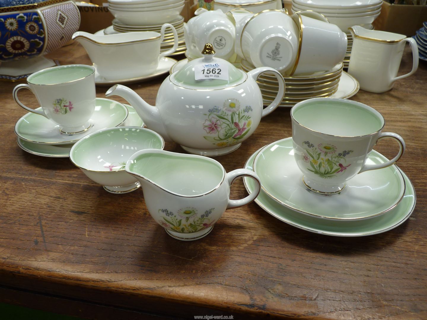 A Susie Cooper "Romance" green Tea for Two comprising teapot, two cups and saucers and tea plates,
