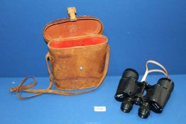 A cased pair of Octra binoculars 10 x 50.