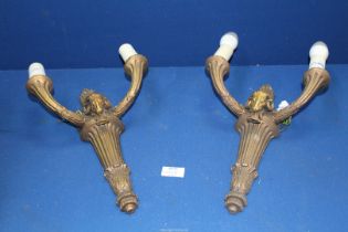 A pair of Empire style two branch wall lights.