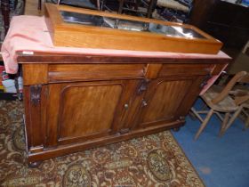 A delightfully plain Mahogany Sideboard having a pair of frieze drawers and a pair of arched