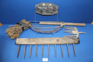 A surveyor's Chain having brass tags, a wood and wrought iron rake head,