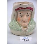 An early Staffordshire character jug, possibly 'Sairey Gamp' 4 1/2" tall.